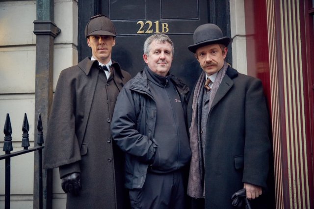 Behind the scenes of Sherlock, “The Abominable Bride.” Left to right: Benedict Cumberbatch (Sherlock Holmes), Douglas Mackinnon, Martin Freeman (Dr. John Watson) Photo by Robert Viglasky